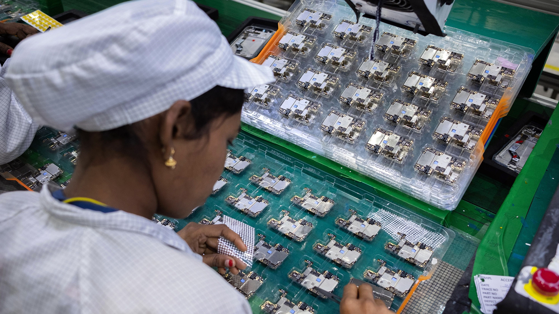 An employee at a Foxconn factory in India. Photo by Bloomberg.